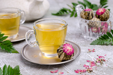 Green tea Bud with a red flower
