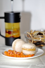 macaroni, vitamin sea buckthorn tea, sea buckthorn on a plate on the table for tea, vitamin good morning at home