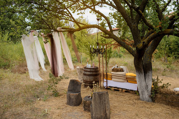 Rustic vintage wedding photo zone outdoor near the trees