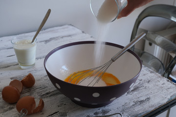 The woman is making cake