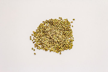 Ripe hemp seeds isolated on white background