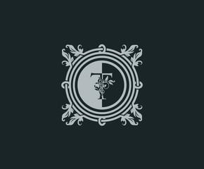Luxury logo design with initial T. Elegant flourishes T Letter. Border carved frame logo template. Vintage vector element.