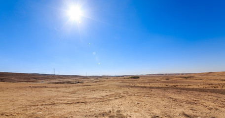 White sun over desert
