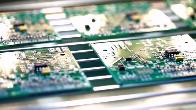 Machine places elements on circuit boards