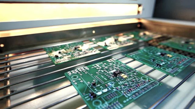 Machine places elements on circuit boards