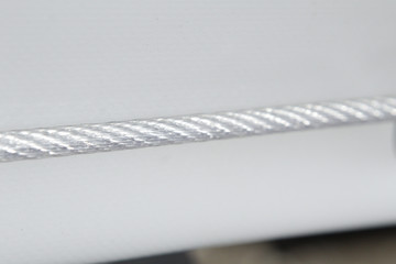 Rubberized metal cable for fastening the awning on board the truck.