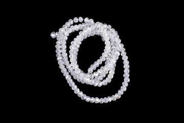 Natural stone beads on a black background isolated