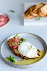 Toast with salmon, poached egg and basil. Morning and Breakfast. Healthy nutrition. Selective focus