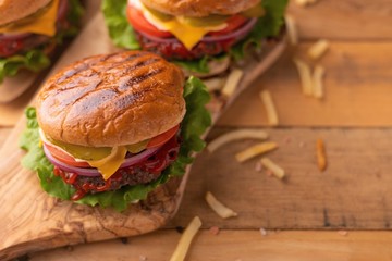 Two juicy burgers and a hamburger. Screensaver for cafes, restaurants, home recipe book, food truck