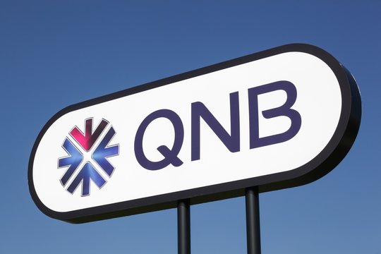 Aarhus, Denmark - March 30, 2019: QNB logo on a panel. QNB, Qatar National Bank is a Qatari commercial bank headquartered in Doha, Qatar