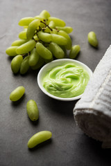 Green grapes, yogurt and honey mix face mask or cream for skin dark spot removal treatment, created using Angoor extract, curd and honey. selective focus