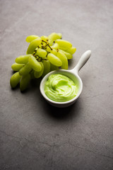 Green grapes, yogurt and honey mix face mask or cream for skin dark spot removal treatment, created using Angoor extract, curd and honey. selective focus