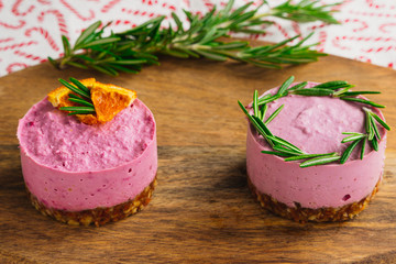 Christmas and raw dessert. Wooden plate