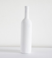 Silhouette of a wine bottle on a white background.