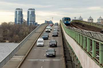 Cars in the morning traffic jam ride on the metro bridge in Kiev. Caption: Academic housing