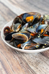Mussel with white wine sauce on table