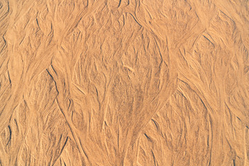 sand texture with wavy lines and jets of water