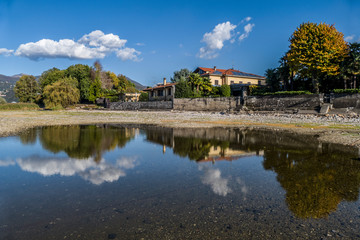 Fototapeta na wymiar Reflection on the Lake Maggiore in Germignaga