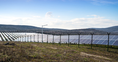 View of a solar energy station on a field