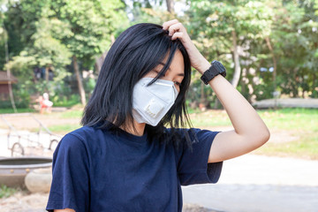 Asian women wearing medical protective masks to prevent virus infection. Corona virus or Covid-19, Healthcare concept