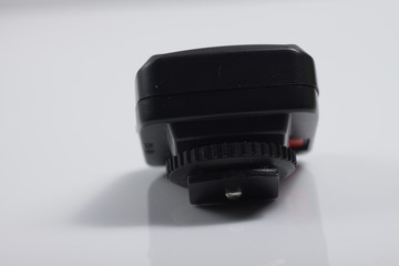 Close up shot of black camera flash trigger isolated on white background