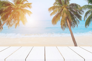 beach background,top of wood table with blurred sea and coconut tree background
