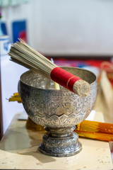 Wood and holy water bowl for making merit