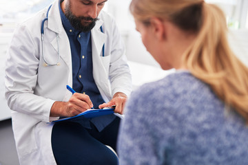 Woman speaks to doctor about her ailment