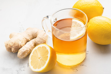 Alternative medicine, natural home remedy for cold and flu. Hot herbal tea with ginger and lemon