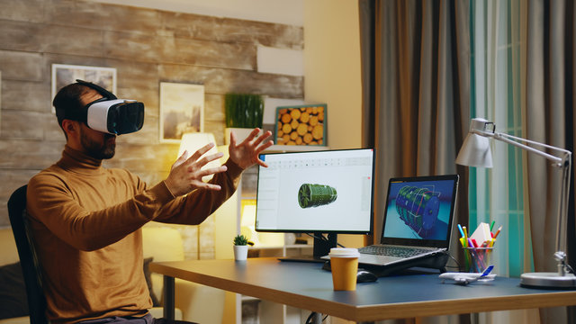 Engineer with virtual reality headset at his desk