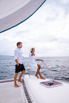 St Lucia, Couple Men And Woman Watching Sunset From Sailing Boat In The Caribbean Sea Near Saint Lucia Or St Lucia