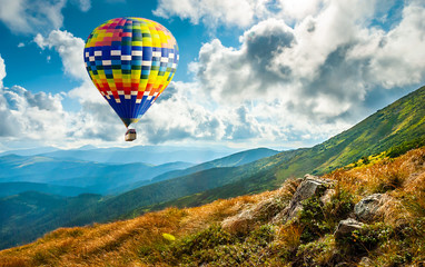 Fototapeta premium Amazing view of mountains with colorful hot air balloon. Travel concept. Artistic picture. Beauty world.