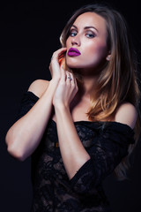 young lady posing emotional on black background, lifestyle people concept