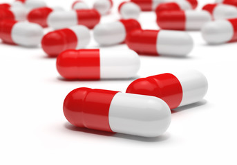 Red and white capsules pill on white background, 3d rendering