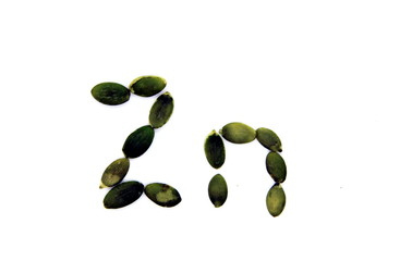 inscription Zinc from pumpkin seeds on a white background