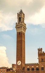 Fototapeta premium Ancient tower on town hall building in medieval city of Siena