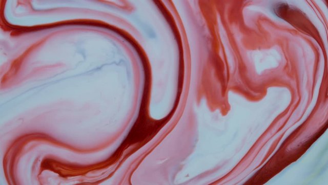 Marbling, multi-colored swirled, stone-like patterns. Paint floating, spreading on the surface of a liquid. Abstract fluid art, ink in motion. Magical marble texture. Ink bloom, blast, paint explosion