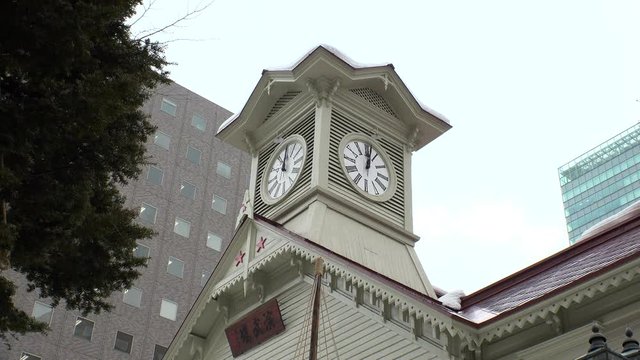 SAPPORO, HOKKAIDO, JAPAN - FEB 2020 : View of Sapporo Clock Tower (Tokeidai). It was built in 1878 and is therefore regarded as both a historical and cultural symbol of Sapporo city.