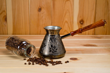 Cezve copper coffee maker with wooden handle for making coffee on an open fire. Background for the menu of restaurants, coffee houses and publications about coffee.