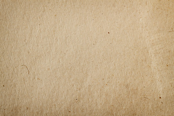 Texture of old organic cardboard with various villi, fluff and other inclusions. Recyclable material. Natural vintage background