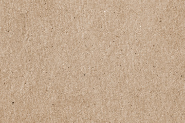 Cardboard, old paper texture background close-up, surface with small inclusions of cellulose