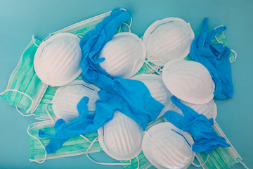 White and green medical masks and medical gloves protection against pollution, virus, flu and coronavirus.