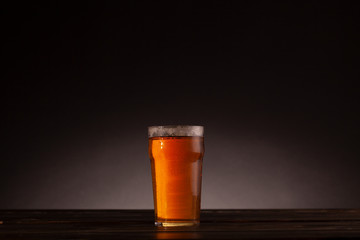 Pint of beer on a dark background