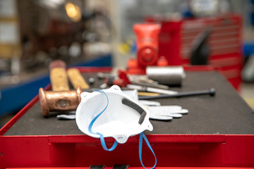 medical respirator mask at workplace in factory to protect health from viral disease