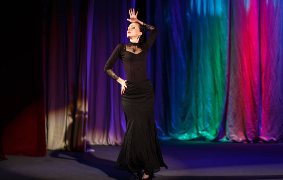 Emotional Actress In Black Dress Dancing And Playing A Role On The Stage Of The Theater.