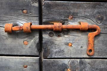 Cravegna (VCO), Italy - December 19, 2017: A door's bolt on an old house, Vigezzo Valley, VCO, Piedmon, Italy