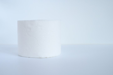 rolled white toilet paper in a white background. space for text