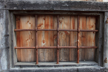 Cravegna (VCO), Italy - December 19, 2017: An old window with a iron grate, Vigezzo Valley, VCO, Piedmon, Italy