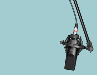 black professional microphone on a stand with clipping path