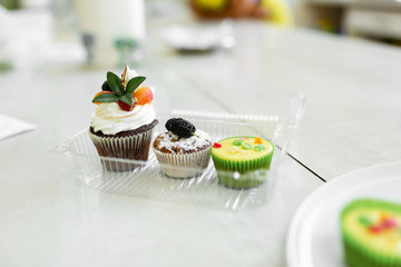 Plate with freshly baked sweet muffins. Sweet pastries, recipes, cooking